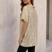 Side and back view of FJØRNA women's sequined V-neck top with draped short sleeves, perfect for evening wear.