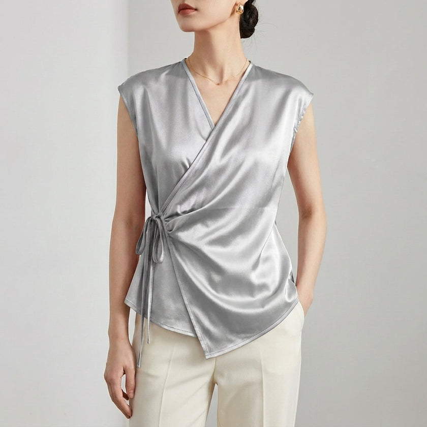 Silver FJØRNA women's sleeveless satin summer blouse with a V-neck, stylish and lightweight for warm weather.