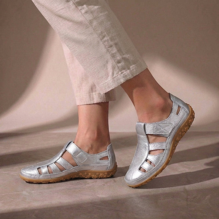 Silver FJØRNA orthopedic cutout fisherman sandals for women, featuring open heel and adjustable straps.