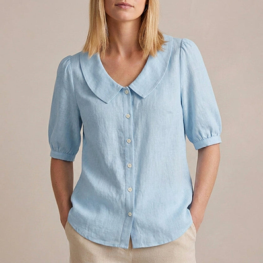 Sky blue FJØRNA women's summer puff sleeve linen blouse with button front, casual and stylish top for warm weather.