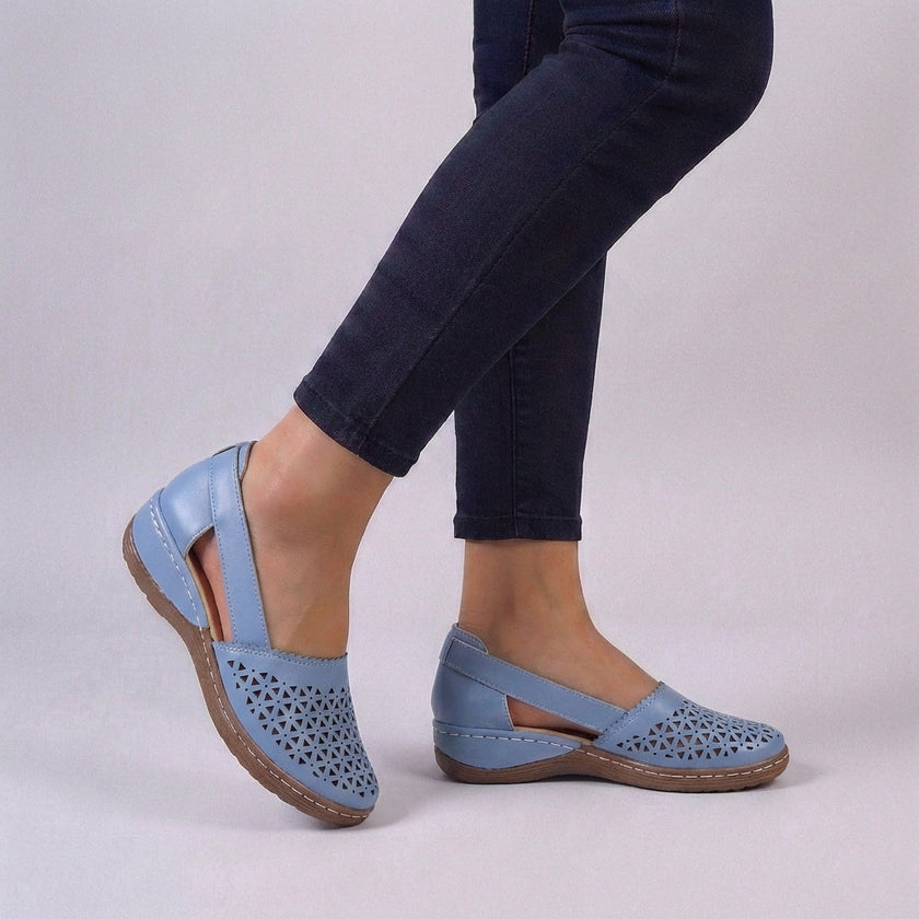 Sky blue orthopedic wedge sandals by FJØRNA with scalloped trim and side cut-outs, showcasing comfortable summer footwear.