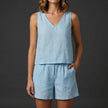 Sky blue women's two-piece summer co-ord set with pleated V-neck top and matching skirt by FJØRNA.
