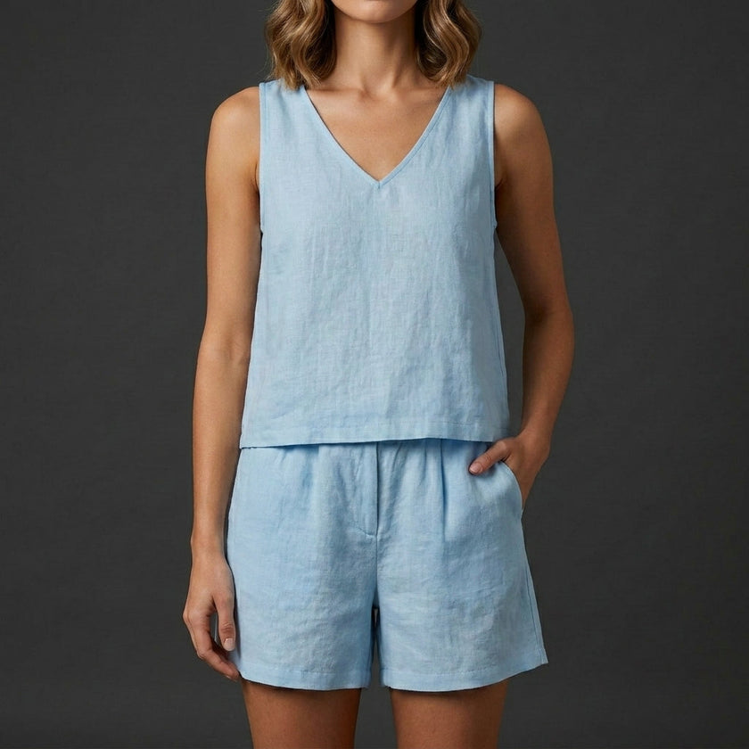 Sky blue women's two-piece summer co-ord set with pleated V-neck top and matching skirt by FJØRNA.