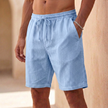 Sky blue men's casual drawstring shorts with straight legs and side pockets, made by FJØRNA.