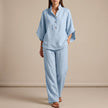 Sky blue FJØRNA woven two-piece relaxed shirt and wide-leg trouser set, casual urban leisure style, lightweight fabric.