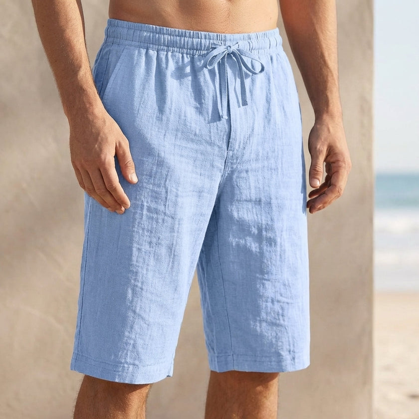 Sky blue men's casual knee-length chino shorts with adjustable drawstring waist, perfect for vacation wear.