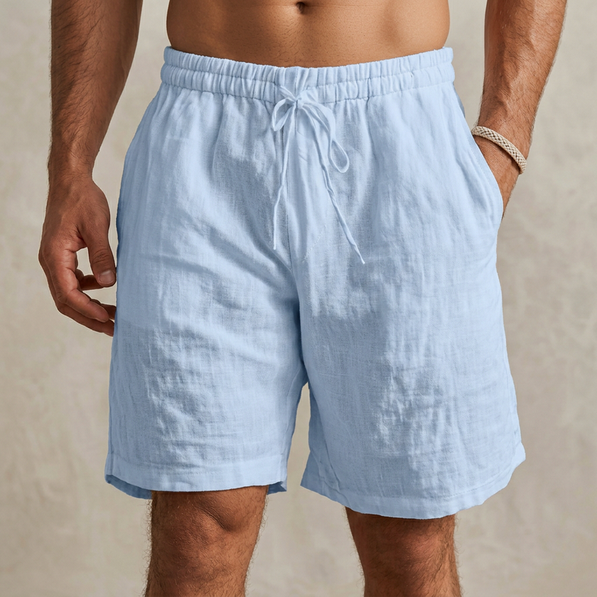 Sky blue men's casual drawstring shorts with side pockets from FJØRNA, featuring a relaxed fit and comfortable design.