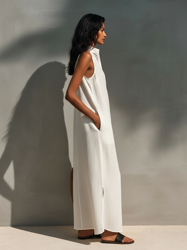 FJØRNA sleeveless maxi dress for women, flowing fabric, ankle-length design, perfect for summer or casual occasions.