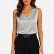 Elegant women's satin sleeveless blouse with V-neck, silky fabric, by FJØRNA, perfect for stylish and sophisticated looks.