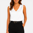 Elegant women's satin sleeveless blouse with V-neck and silky finish, ideal for stylish occasions, by FJØRNA.