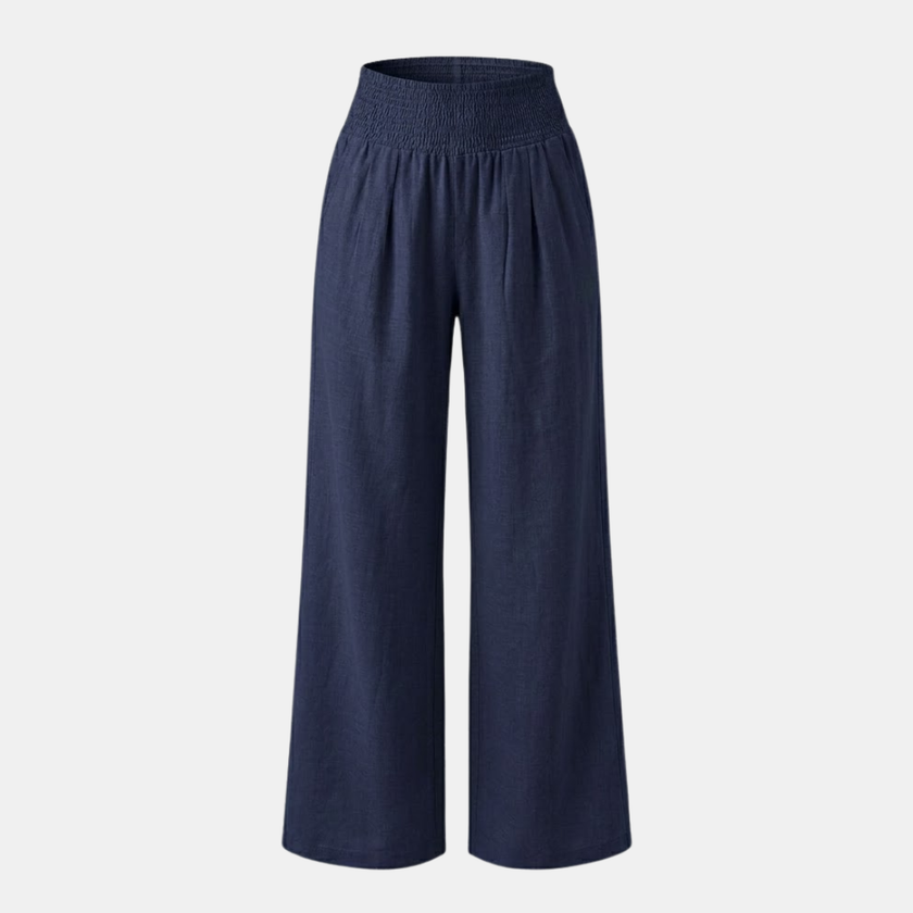 FJØRNA women's linen blend wide-leg trousers with smocked waist and relaxed fit, featuring an elastic waistband and flowy design.