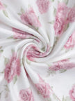 White floral tube mini dress by FJØRNA featuring a soft girl style, shown on a model with a fitted silhouette.