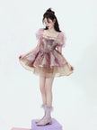 White soft girl puff sleeve layered mini dress by FJØRNA, featuring a feminine design and layered skirt detail.