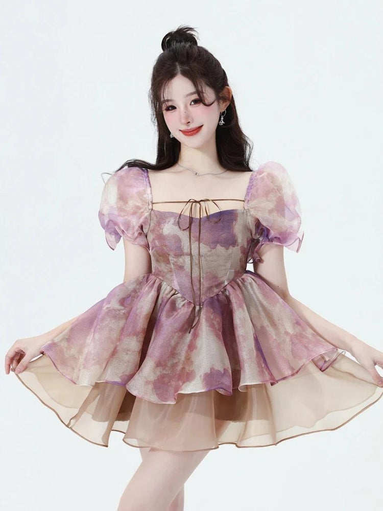 White layered mini dress with puff sleeves by FJØRNA, featuring a soft girl style and feminine, layered design.