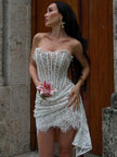 FJØRNA strapless lace mini dress featuring a fitted bodice and flared skirt, perfect for party or daytime occasions.