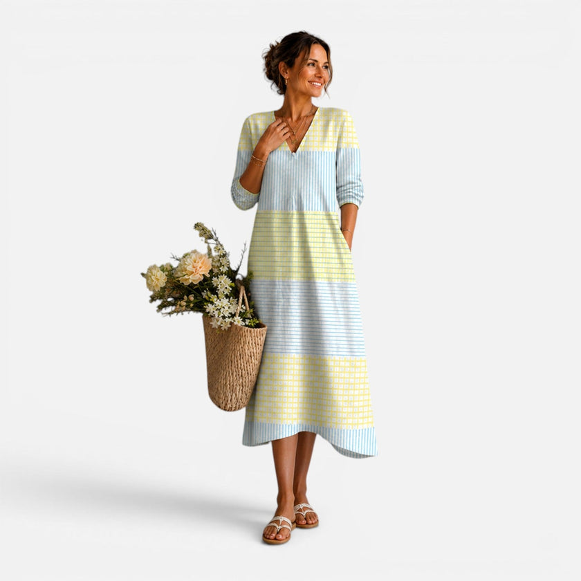 Women's lightweight midi dress by FJØRNA with breathable fabric and colorful stripe pattern, ideal for summer wear.