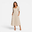 Women's striped midi dress with button details and pockets by FJØRNA, featuring a stylish and comfortable design.