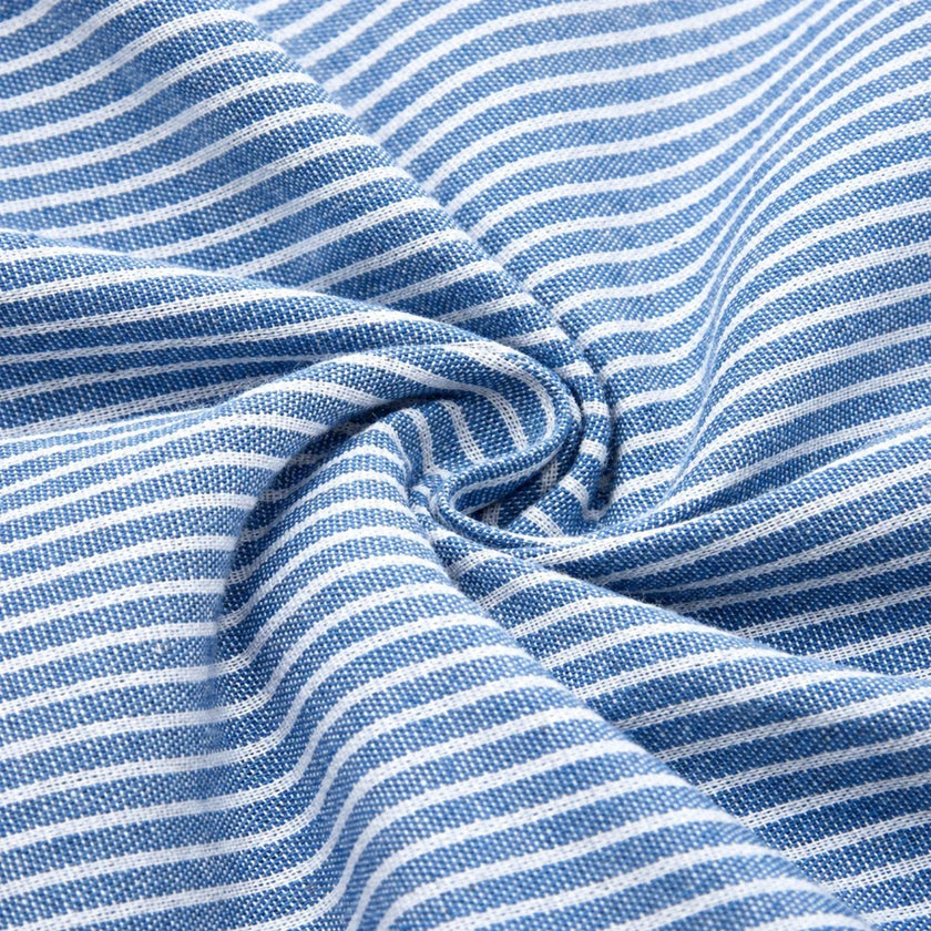 FJØRNA women's striped midi dress with button details and side pockets, stylish and comfortable for everyday wear.