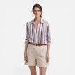 Lightweight women's vertical stripe summer blouse by FJØRNA, featuring stylish vertical stripes and a relaxed fit.