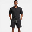 Men's structured knit polo shorts set by FJØRNA featuring breathable fabric, perfect for stylish summer wear.