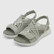 FJØRNA women's orthopedic criss-cross strappy sandals with adjustable straps, showcasing comfortable and stylish footwear in a studio setting.