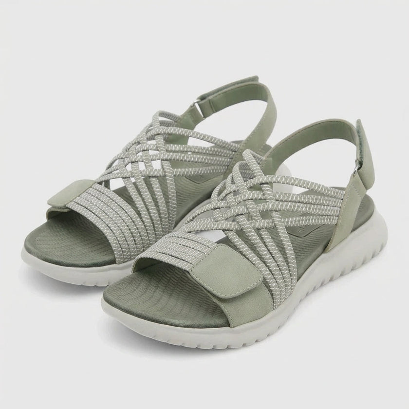 FJØRNA women's orthopedic criss-cross strappy sandals with adjustable straps, showcasing comfortable and stylish footwear in a studio setting.