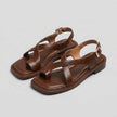 FJØRNA women's square toe block heel criss-cross sandals displayed on studio background, featuring stylish design and open toe style.