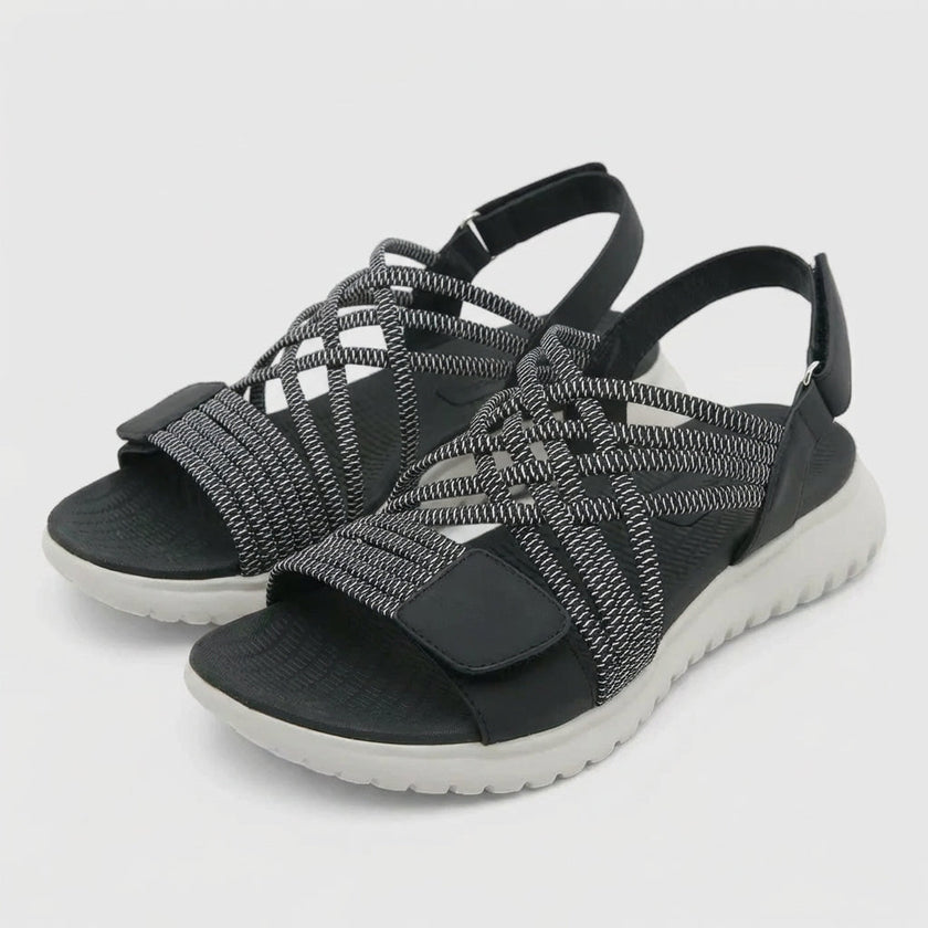 FJØRNA orthopedic criss-cross strappy women's sandals with adjustable fit, featuring supportive design and stylish straps.