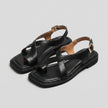 FJØRNA square toe block heel criss-cross sandals for women, featuring a stylish open-toe design and ankle straps.