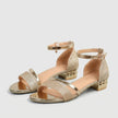 FJØRNA orthopedic metallic block heel ankle strap sandals for women, featuring a stylish design and ankle buckle in a studio setting.