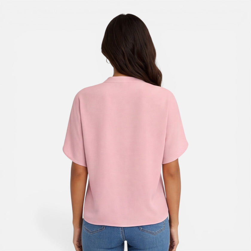 Lightweight women's chiffon blouse with V-neck from FJØRNA, perfect for casual summer wear. Blue, flowy, and breathable.