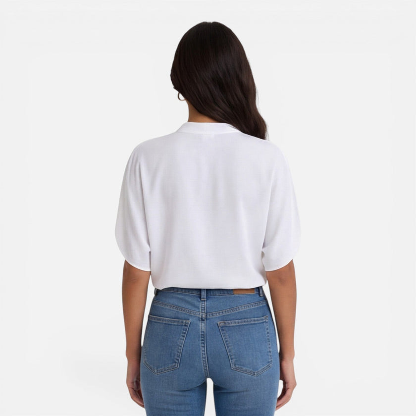 FJØRNA women's lightweight chiffon V-neck summer blouse, casual and breezy for warm weather, shown in a soft pastel color.