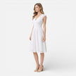 Women's elegant summer midi dress by FJØRNA featuring cotton lace fabric, perfect for wedding guest occasions.