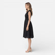 Women's elegant summer midi dress by FJØRNA, made of cotton lace, perfect for wedding guest occasions.