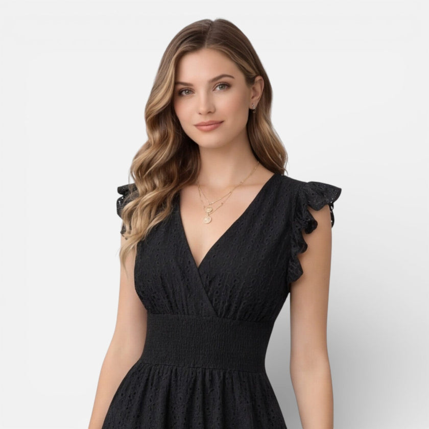Women's elegant summer midi dress by FJØRNA featuring cotton lace, perfect for wedding guest attire, with a flowy and stylish design.