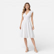 Women's elegant summer midi dress by FJØRNA featuring cotton lace fabric, perfect for wedding guest attire.