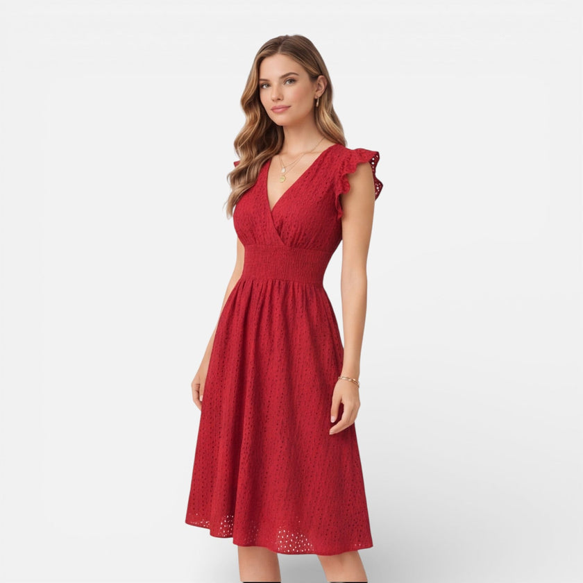 Women's elegant summer midi dress by FJØRNA, made of cotton lace, perfect for wedding guests and warm weather occasions.