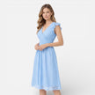 Women's elegant summer midi dress by FJØRNA featuring cotton lace, perfect for wedding guests and warm weather occasions.