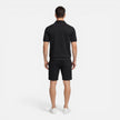 Men's summer matching set with zip shirt and drawstring shorts, slim fit style by FJØRNA, shown in a casual outdoor setting.