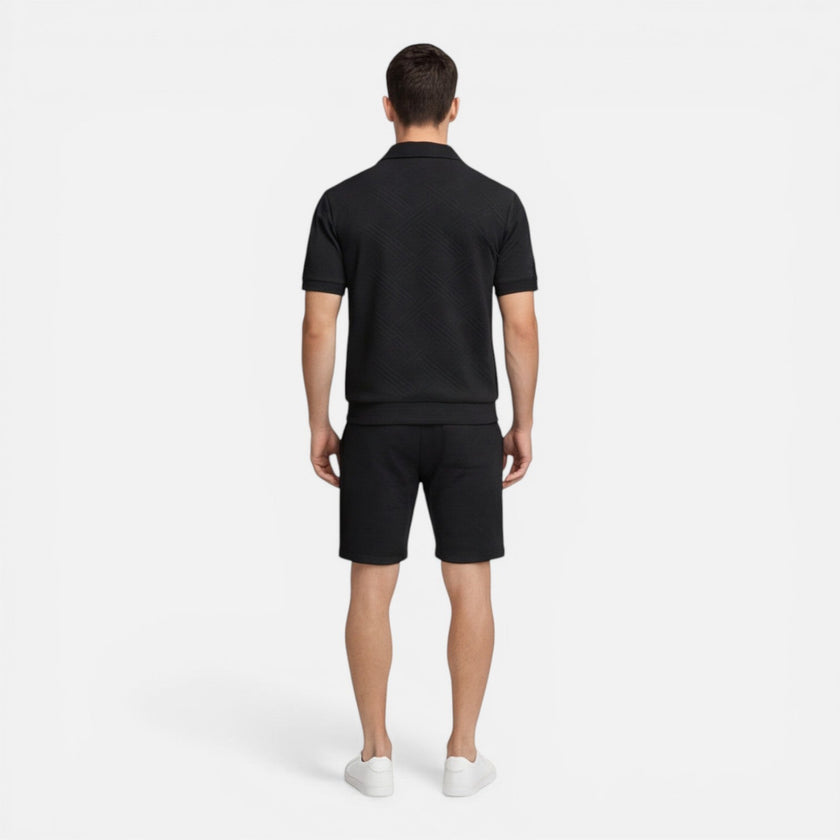 Men's summer matching set with zip shirt and drawstring shorts, slim fit style by FJØRNA, shown in a casual outdoor setting.