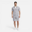 Men's summer matching set by FJØRNA with zip shirt and drawstring slim-fit shorts, ideal for warm weather.
