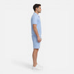 Men's summer matching set by FJØRNA featuring a zip shirt and drawstring shorts in a slim fit, ideal for warm weather.