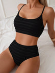 Women's solid texture bikini set by FJØRNA featuring a stylish, single-color swimwear design perfect for beach and summer.