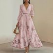 FJØRNA pleated belted A-line maxi dress for women, flowing fabric with a waist belt and elegant pleats, full-length image.