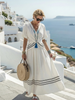 FJØRNA women's summer midi dress with V-neck, short sleeves, and wrap style, perfect for warm weather and casual occasions.