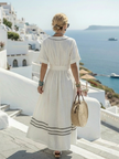 FJØRNA women’s summer midi dress with short sleeves, v-neck wrap style, flowy relaxed fit, perfect for warm weather.