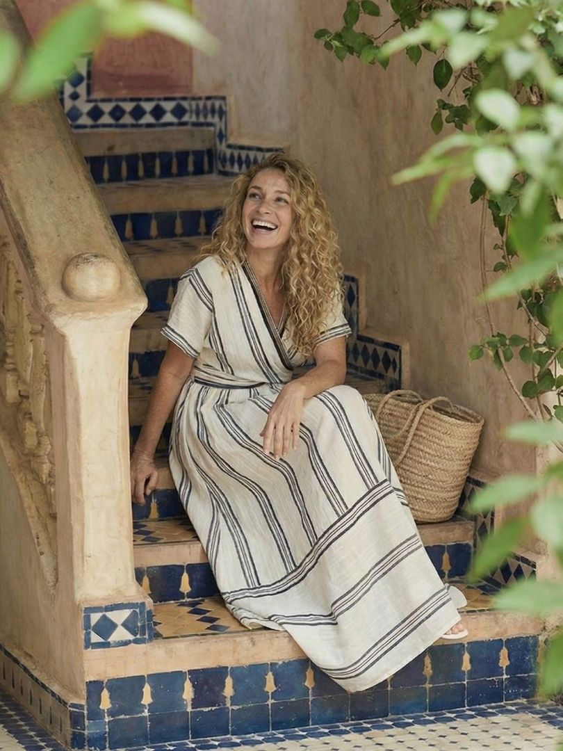 FJØRNA summer midi dress for women with short sleeves and wrap style, featuring a flowy design inspired by Santorini days.