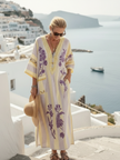 FJØRNA women's floral summer maxi dress with V-neck and short sleeves, perfect for warm weather and casual outings.