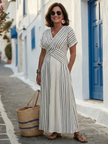 FJØRNA women's summer midi dress with V-neck, short sleeves, flowy fabric, perfect for warm-weather style.