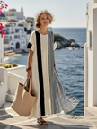 FJØRNA women's summer maxi dress with striped pattern, short sleeves, flowy fit, perfect for warm weather.